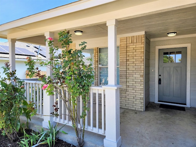 doorway to property featuring a porch