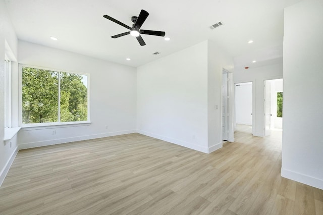 empty room featuring light hardwood / wood-style flooring and ceiling fan