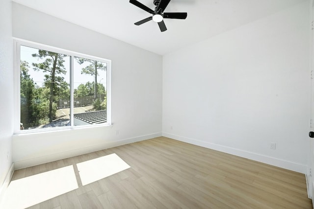 spare room featuring ceiling fan and light hardwood / wood-style floors