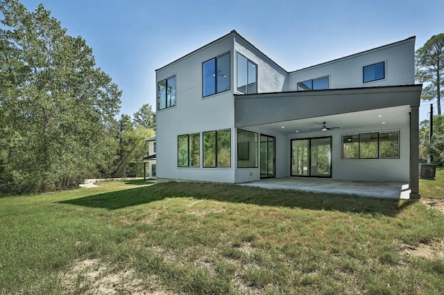 back of property featuring a yard, ceiling fan, a patio area, and central air condition unit