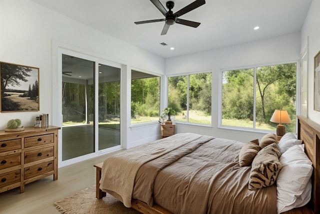 bedroom featuring ceiling fan, light wood-type flooring, and access to outside