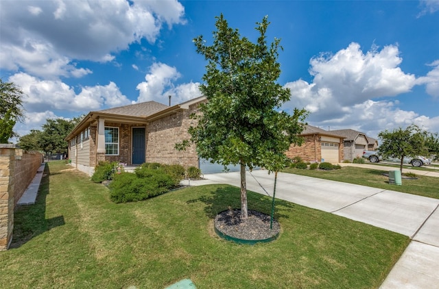 view of front of house featuring a front yard and a garage