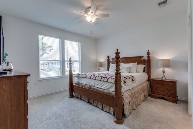 bedroom featuring ceiling fan and light colored carpet