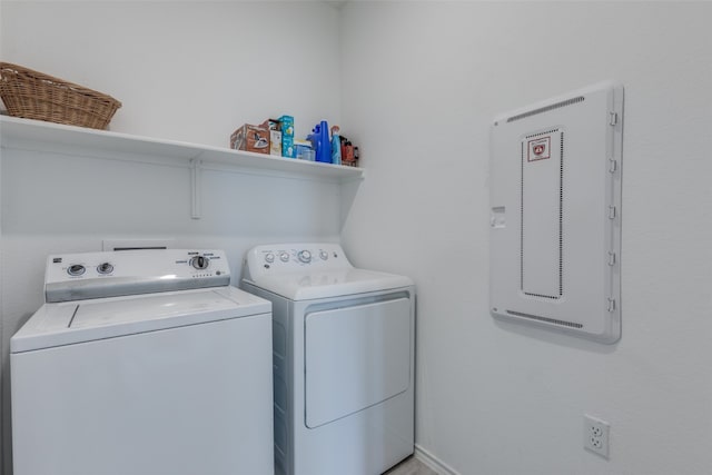 laundry room with separate washer and dryer and electric panel