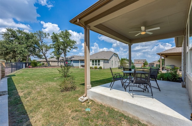 view of yard featuring ceiling fan and a patio area