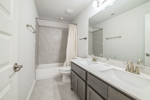 full bathroom featuring tile patterned flooring, vanity, toilet, and shower / bathtub combination with curtain