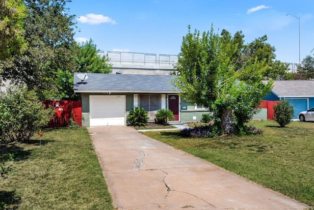 single story home featuring a front yard and a garage