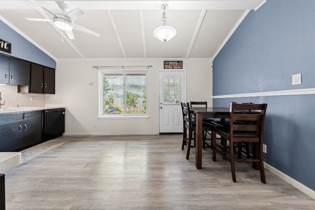 dining space with vaulted ceiling, ceiling fan, and light wood-type flooring