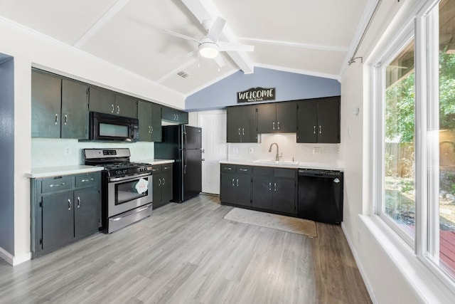 kitchen with sink, vaulted ceiling with beams, decorative backsplash, black appliances, and light hardwood / wood-style flooring