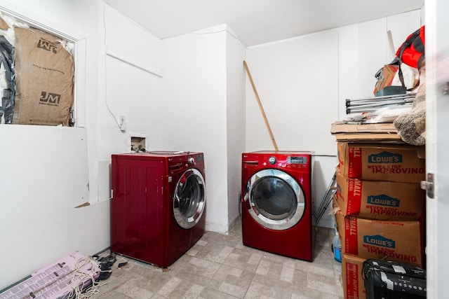 clothes washing area featuring washing machine and clothes dryer