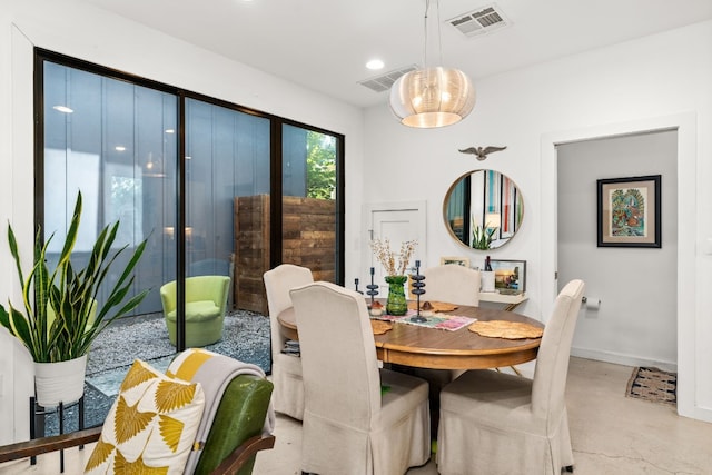 dining area featuring a notable chandelier