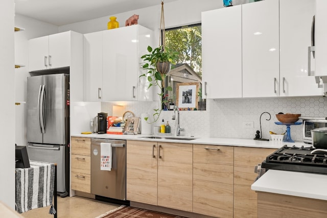 1001 Juanita St, Austin, TX 78704 - kitchen featuring stainless steel appliances, light countertops, and backsplash