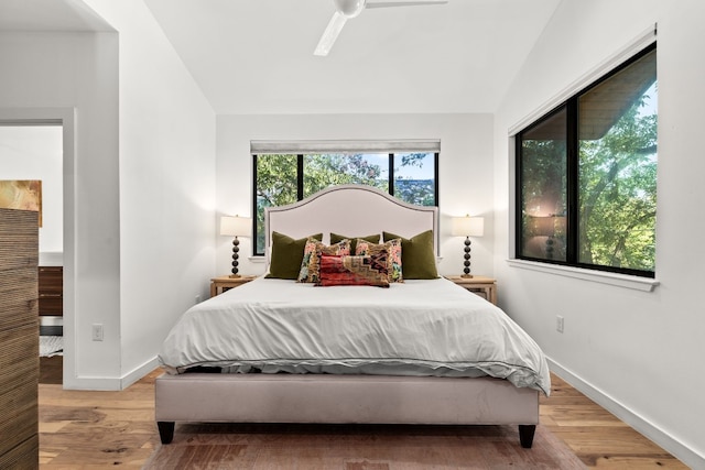 1001 Juanita St, Austin, TX 78704 - bedroom with light wood-style flooring, vaulted ceiling, and a ceiling fan