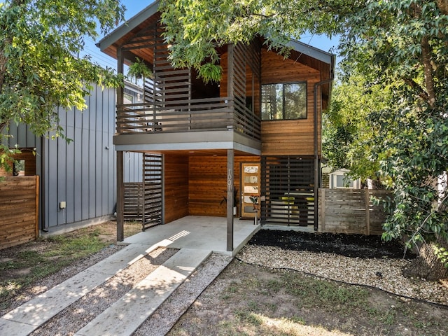 view of front of home featuring stairway and board and batten siding