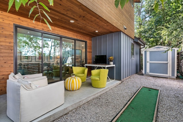 exterior space with a shed, an outdoor hangout area, and an outbuilding