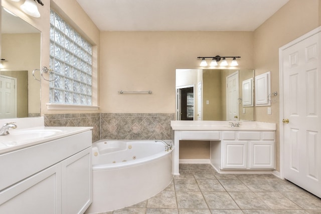 bathroom with vanity, a bathing tub, and tile patterned flooring