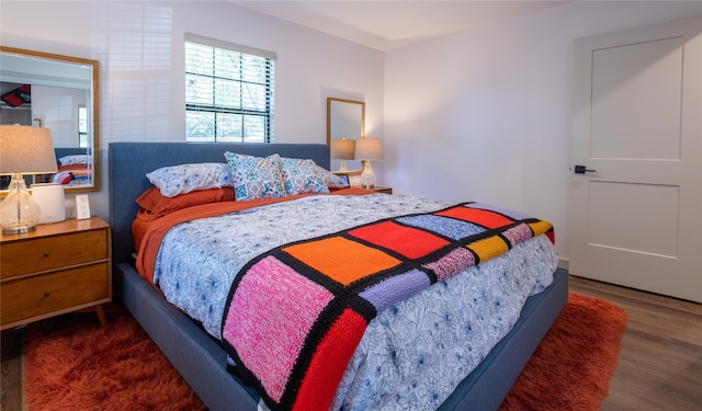 bedroom with dark wood-type flooring