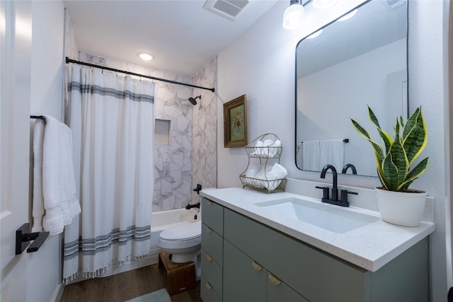 full bathroom featuring shower / tub combo, vanity, toilet, and hardwood / wood-style flooring