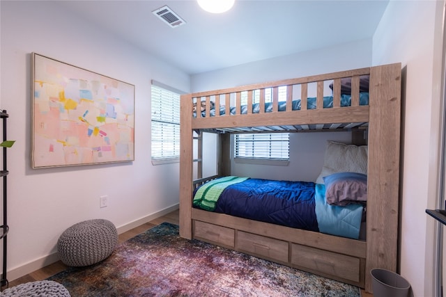 bedroom with wood-type flooring