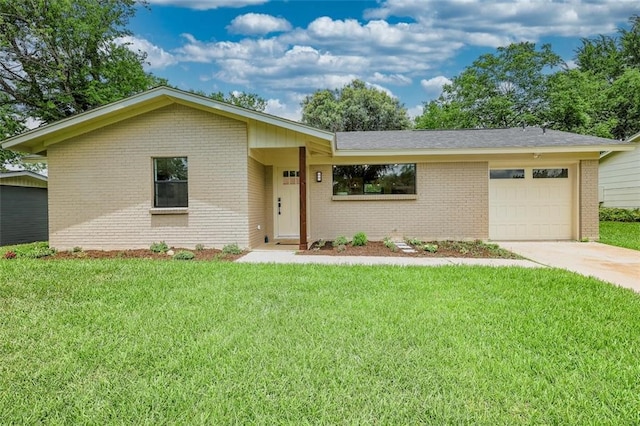 ranch-style house with a garage and a front yard