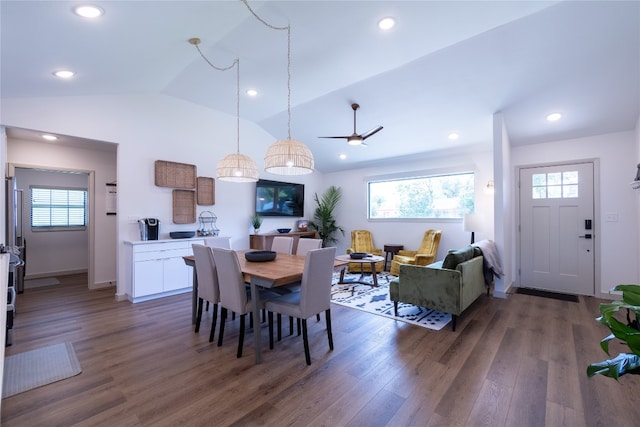 dining area with lofted ceiling, dark hardwood / wood-style flooring, and ceiling fan