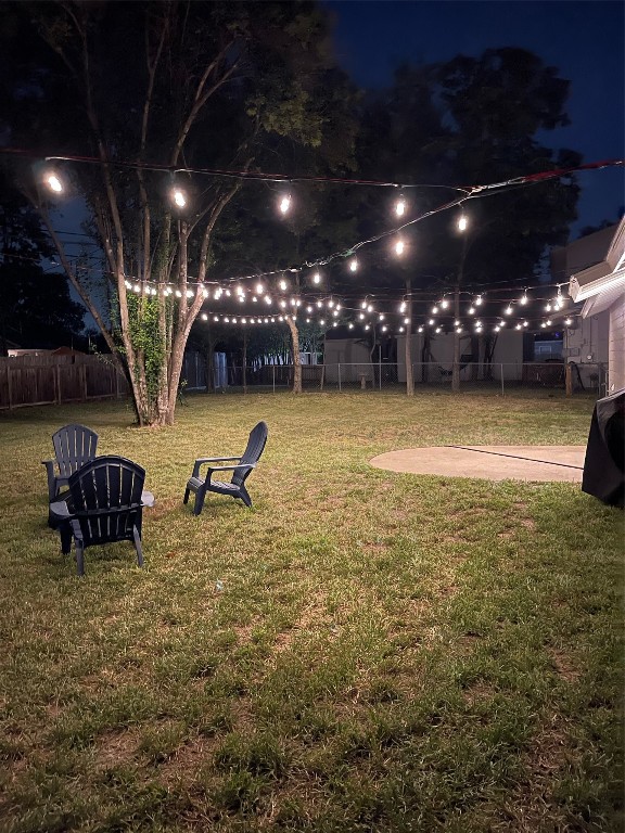 view of yard at twilight