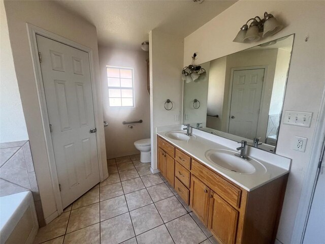 2207 Gail Dr, Copperas Cove, TX 76522 - full bath with toilet, double vanity, and tile patterned flooring