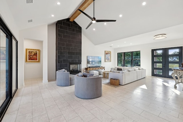 living room featuring high vaulted ceiling, ceiling fan, beamed ceiling, and a fireplace