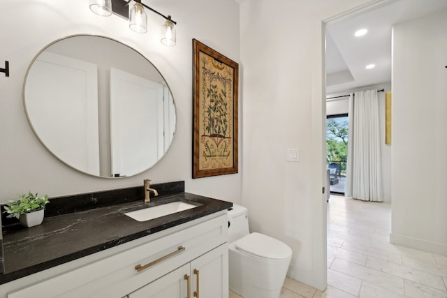 bathroom with vanity and toilet