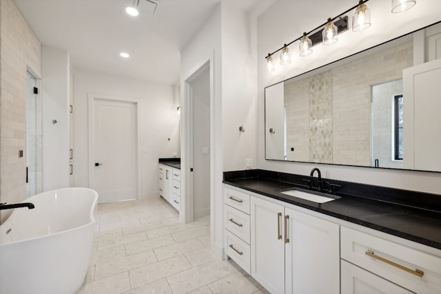 bathroom featuring tile patterned floors, vanity, and separate shower and tub