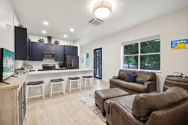 living room featuring light wood-type flooring