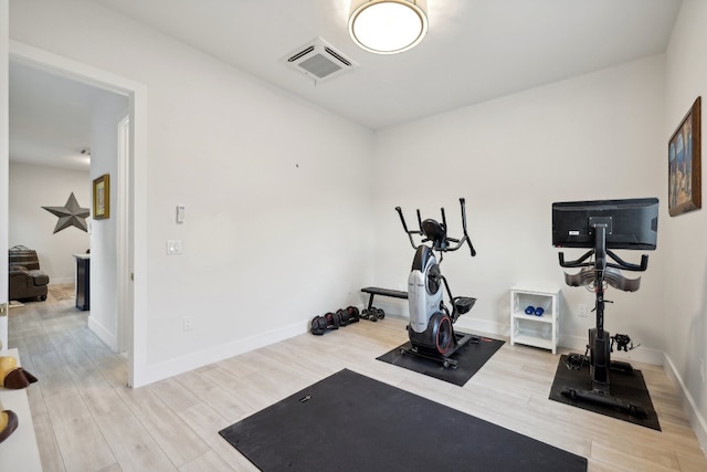 exercise area featuring light hardwood / wood-style flooring