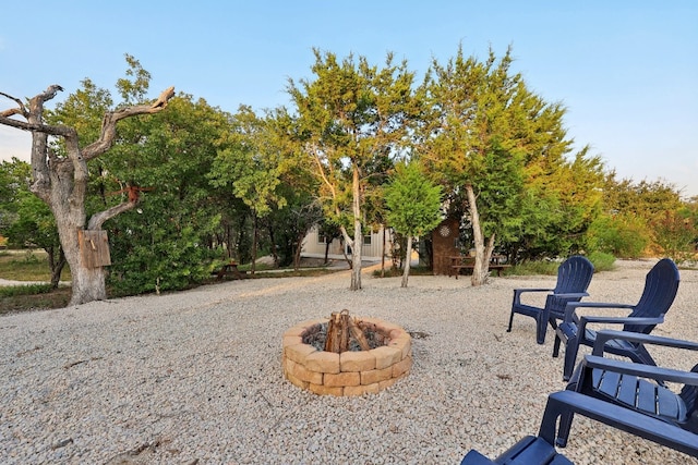 view of yard featuring an outdoor fire pit