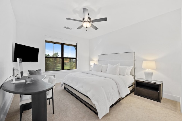 bedroom featuring ceiling fan and light carpet