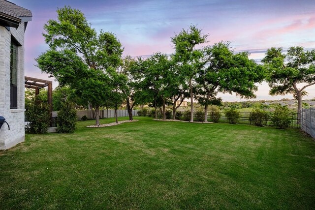 view of yard at dusk