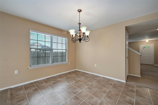 empty room with an inviting chandelier