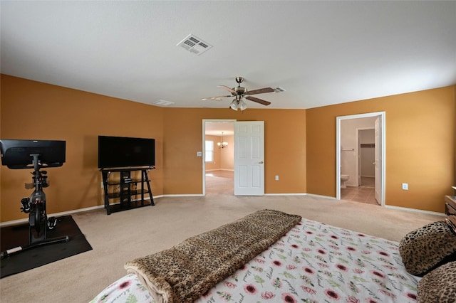 bedroom with ceiling fan and light carpet