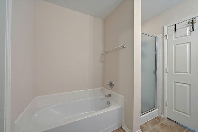 bathroom with tile patterned flooring and plus walk in shower