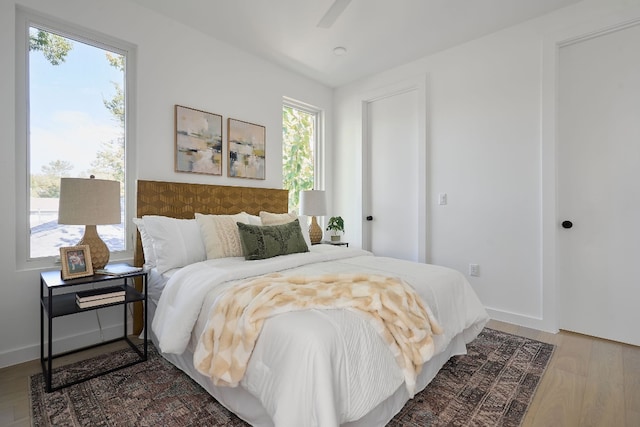 bedroom featuring ceiling fan and wood-type flooring