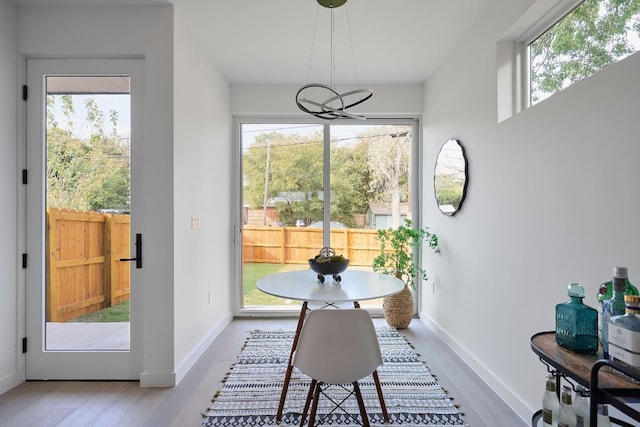 sunroom / solarium featuring plenty of natural light