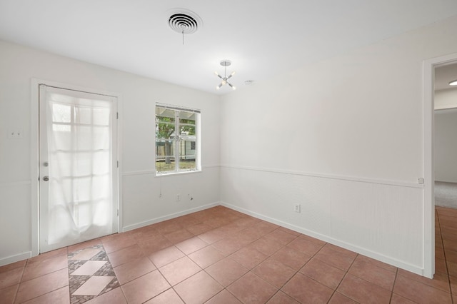 5807 Wynona Ave, Austin, TX 78756 - unfurnished dining area with a chandelier and tile patterned flooring