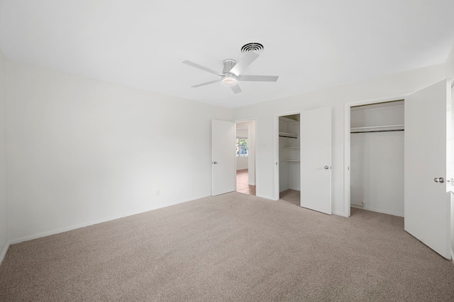 5807 Wynona Ave, Austin, TX 78756 - unfurnished bedroom featuring two closets, light colored carpet, and a ceiling fan