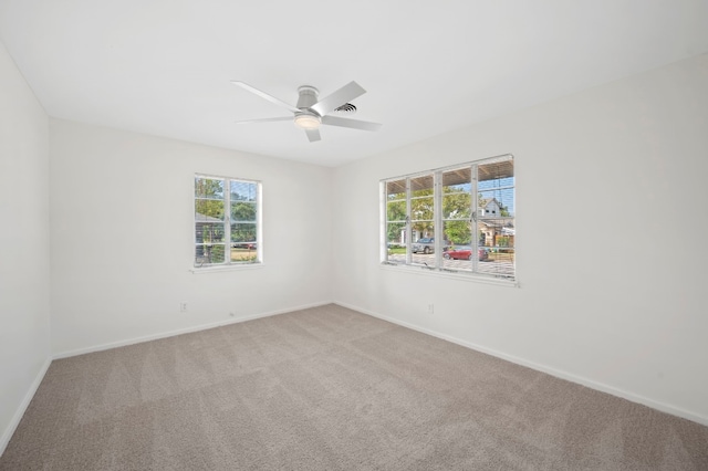 empty room with carpet and ceiling fan