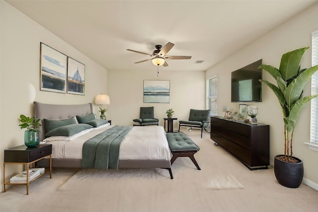 carpeted bedroom featuring ceiling fan