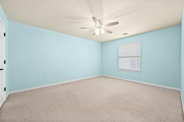 carpeted empty room with ceiling fan