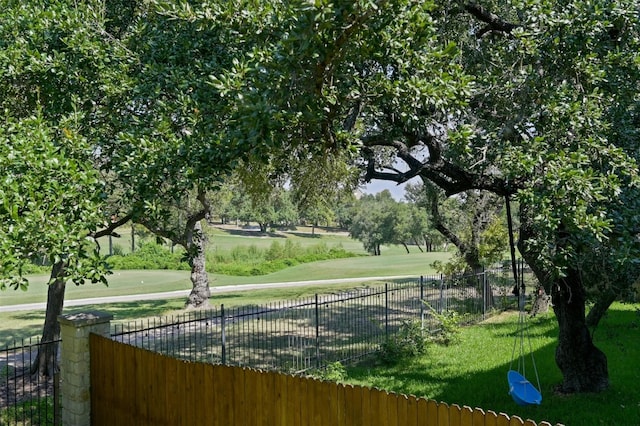 view of property's community featuring a lawn