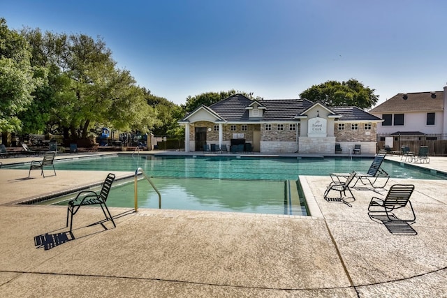 view of swimming pool featuring a patio area