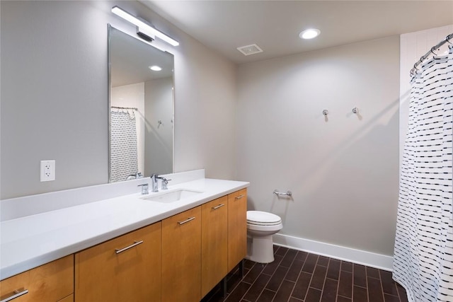 bathroom featuring walk in shower, vanity, toilet, and wood-type flooring