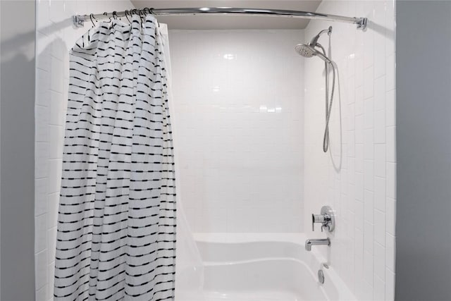 bathroom featuring shower / bathtub combination with curtain