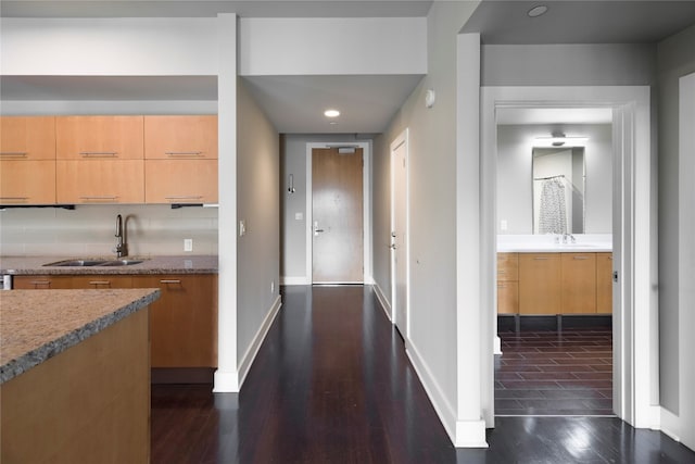 hall with sink and dark hardwood / wood-style floors